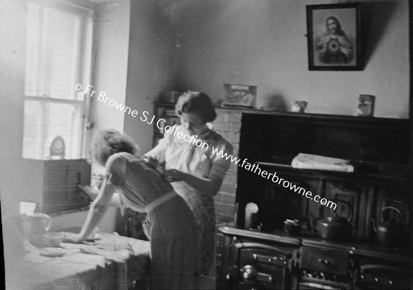 ON THE WAY TO CLARE ISLAND TWO WOMEN IN KITCHEN